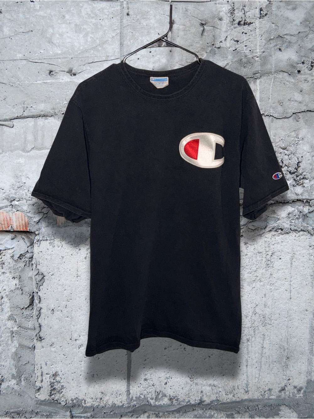 Champion Black Short Sleeve Tee with Red & White Logo Patch